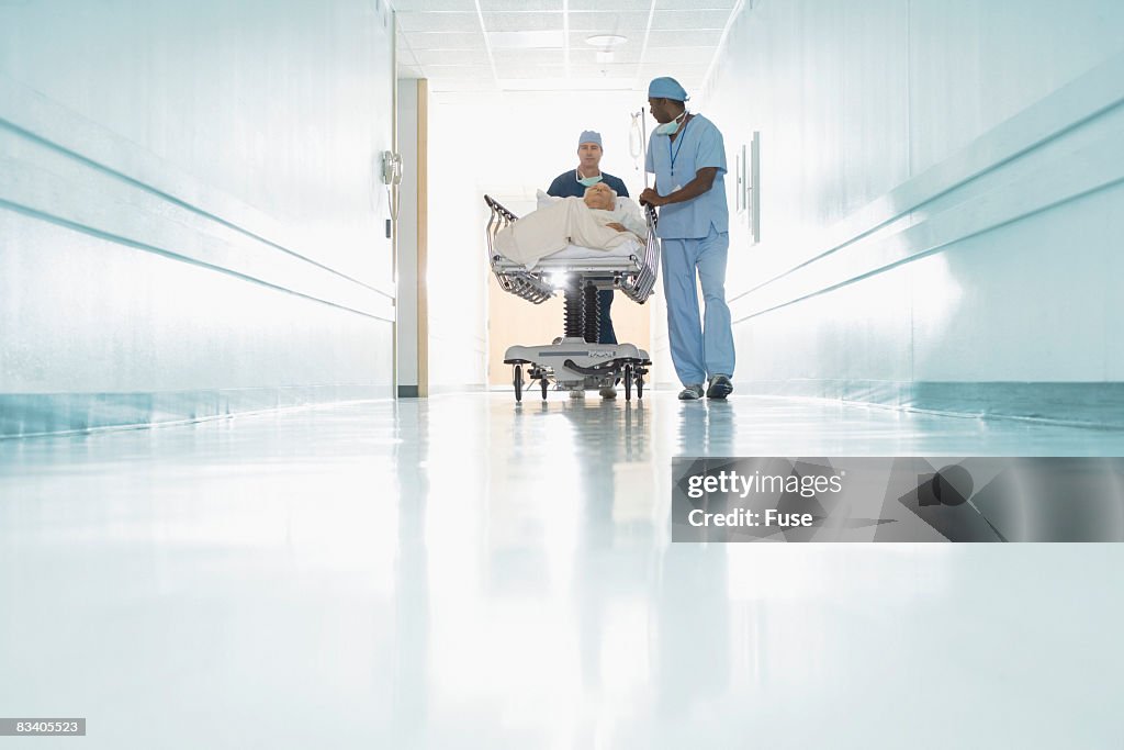 Medical Staff Pushing Patient in Gurney