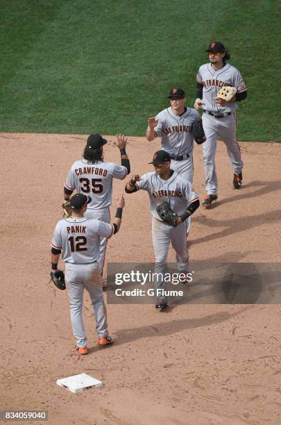 The San Francisco Giants celebrate after a 4-2 victory against the Washington Nationals during Game 1 of a doubleheader at Nationals Park on August...