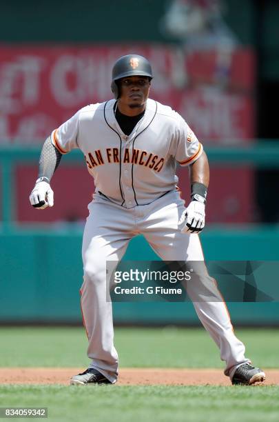 Carlos Moncrief of the San Francisco Giants takes a lead off of first base against the Washington Nationals during Game 1 of a doubleheader at...