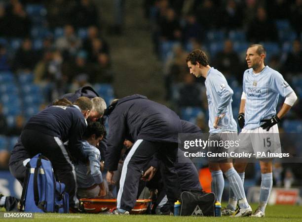 Manchester City's Nery Castillo is helped onto the stretcher