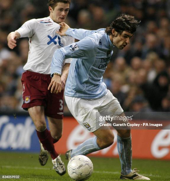 George McCartney, West Ham United and Vedran Corluka, Manchester City battle for the ball