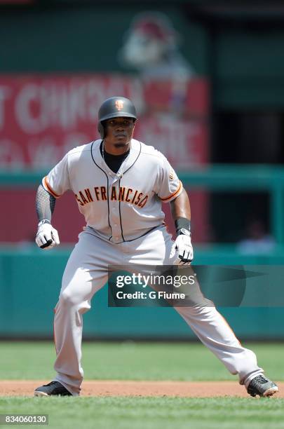 Carlos Moncrief of the San Francisco Giants takes a lead off of first base against the Washington Nationals during Game 1 of a doubleheader at...