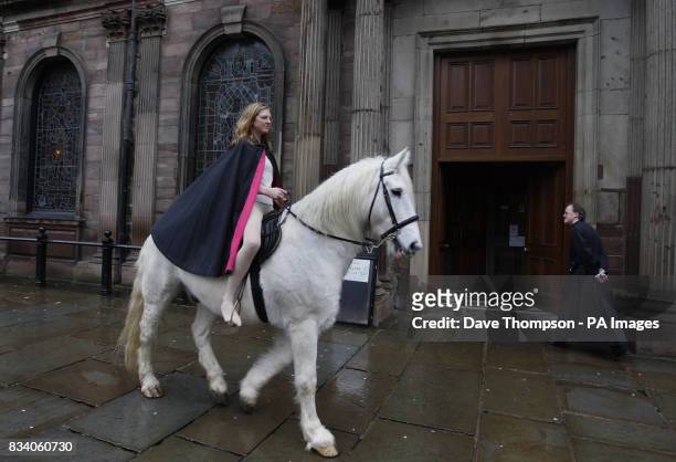 Stunt rider Emily Cox posing as Lady Godiva riding Legend through St. Ann's Square, Manchester.