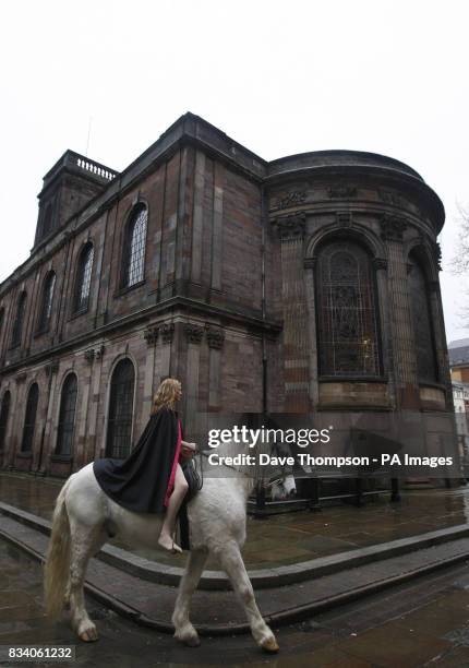 Stunt rider Emily Cox posing as Lady Godiva riding Legend through St. Ann's Square, Manchester.