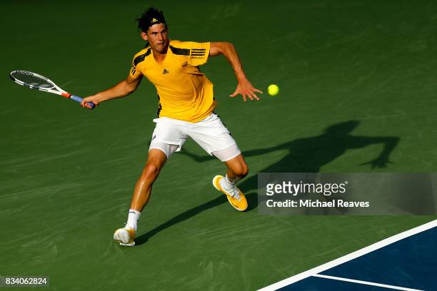 Dominic Thiem of Austria returns a shot to Adrian Mannarino of France during Day 6 of the Western and Southern Open at the Lindner Family Tennis...