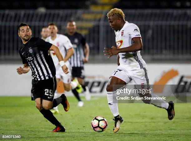 Ezekiel Henty of Videoton in action against Milan Radin of Partizan in action during the UEFA Europa League Qualifying Play-Offs round first leg...