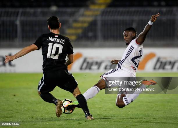 Stopira of Videoton in action against Marko Jankovic of Partizan during the UEFA Europa League Qualifying Play-Offs round first leg match between...