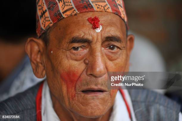 An old man chants tradition songs during celebration of Bagh Bhairab festival celebrated at Kirtipur, Kathmandu, Nepal on Thursday, August 17, 2017....