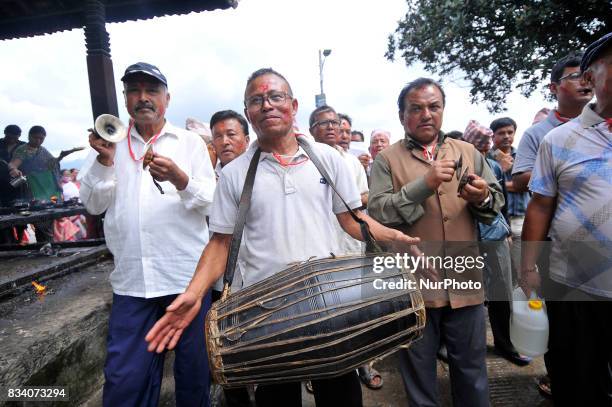 Nepalese devotees plays traditiona instruments during celebration of Bagh Bhairab festival celebrated at Kirtipur, Kathmandu, Nepal on Thursday,...