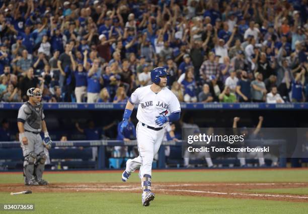 Justin Smoak of the Toronto Blue Jays circles the bases as he hits a two-run home run in the eighth inning during MLB game action against the Tampa...