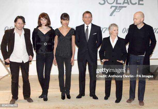 The cast of the new Bond movie, Mathieu Amalric, Gemma Arterton, Olga Kurylenko, Daniel Craig, Dame Judi Dench and Marc Forster pose for the media...