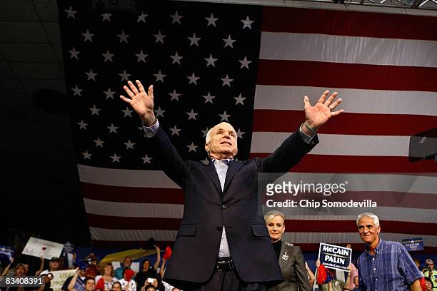 Republican presidential nominee John McCain, his wife Cindy McCain and Florida Gov. Charlie Crist hold a campaign rally at the Robarts Arena October...