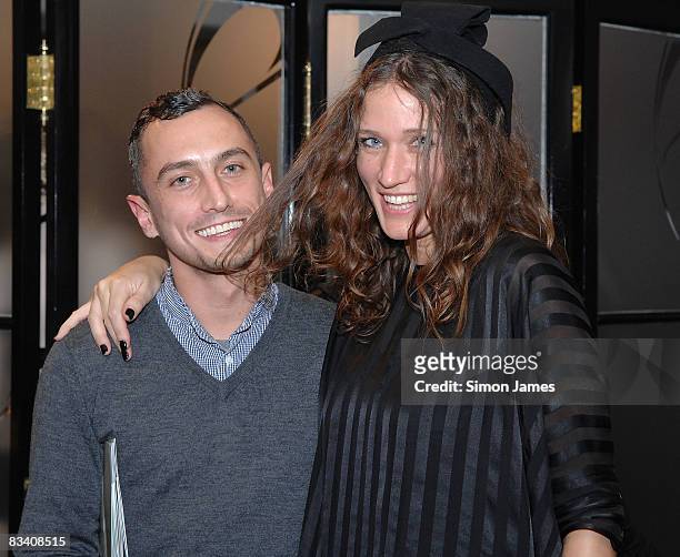 Designer Richard Nicoll and guest attend the Richard Nicoll Trunk Show Spring Summer 2009 collection at the Liberty store on October 23, 2008 in...