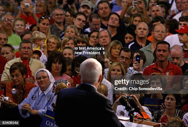 Republican presidential nominee John McCain speaks at a campaign rally aided by a teleprompter at the Robarts Arena October 23, 2008 in Sarasota,...