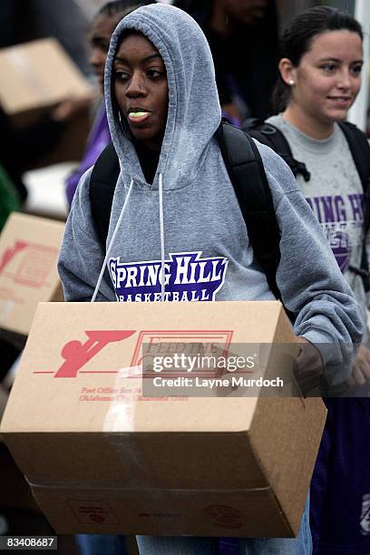 The New Orleans Hornets participate in a food drop in conjunction with Spring Hill College athletes and international hunger relief organization Feed...