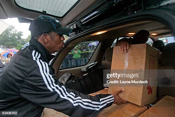 Chris Paul of the New Orleans Hornets participates in a food drop in conjunction with Spring Hill College athletes and international hunger relief...