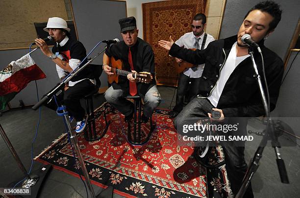 Singer Taboo practices with composer and lead guitarist George Pajon Jounior from Black Eyed Peas and Andy Vargas , singer with the band of Carlos...