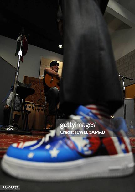 Singer Taboo, wearing a shoe featuring a picture US Democratic presidential candidate Illinois Senator Barack Obama, arrives with lead guitarist...