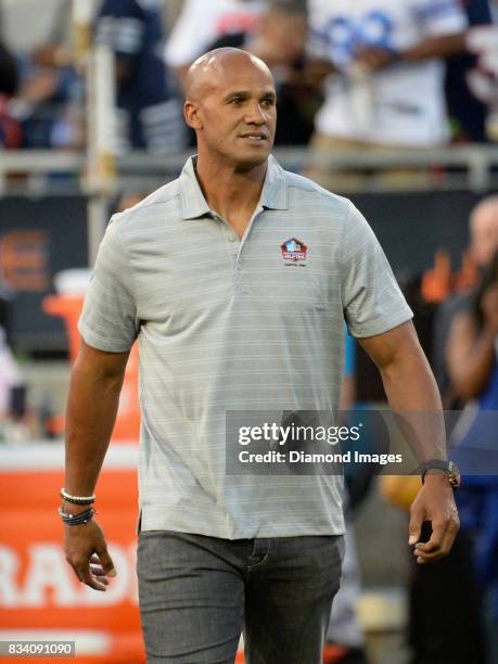 Pro Football Hall of Fame enshrinee, defensive lineman Jason Taylor walks onto the field as he is introduced to the crowd prior to the 2017 Pro...
