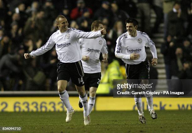 Derby County's Kenny Miller celebrates with his team mates after his shot was turned in by Manchester City's Sun Jihai, giving Derby the first goal...