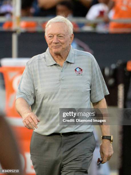 Pro Football Hall of Fame enshrinee, owner/general manager Jerry Jones of the Dallas Cowboys walks onto the field as he is introduced to the crowd...