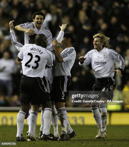 Derby County players celebrate after Kenny Miller's shot was turned in by Manchester City's Sun Jihai, giving Derby the first goal goal of the game.