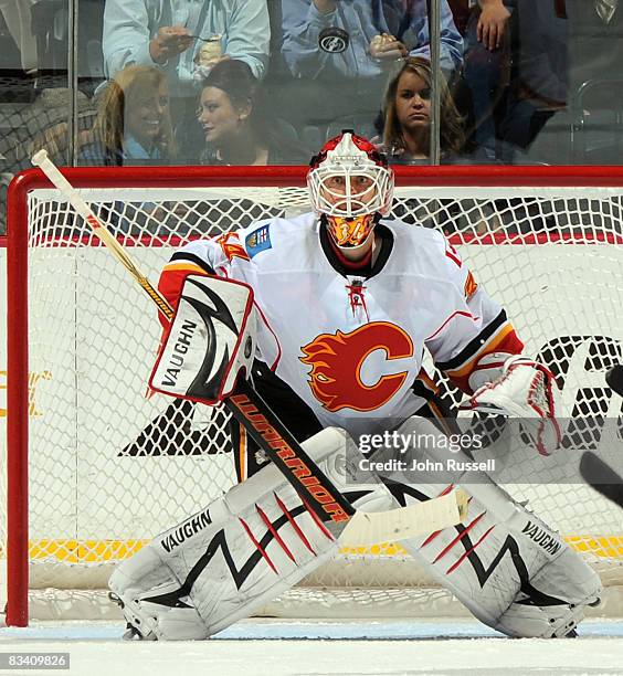 Miikka Kiprusoff of the Calgary Flames eyes the puck against the Nashville Predators during the second period at the Sommet Center on October 23,...