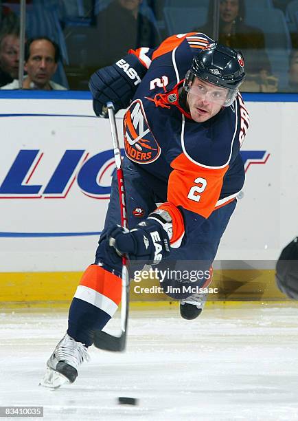 Mark Streit of the New York Islanders shoots the puck against the Dallas Stars on October 23, 2008 at Nassau Coliseum in Uniondale, New York.