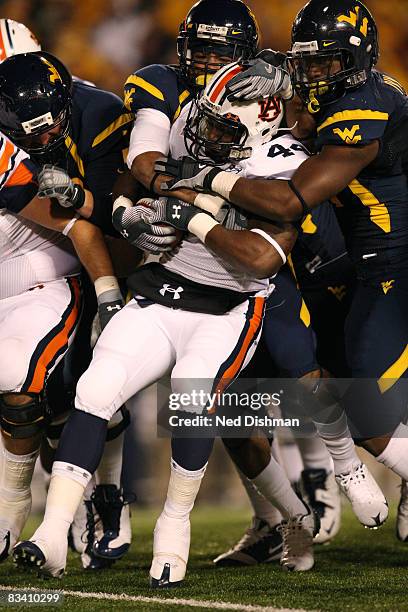 Running back Ben Tate of the Auburn University Tigers is tackled by the West Virginia University Mountaineers on October 23, 2008 at Milan Puskar...