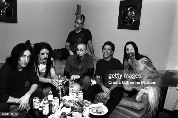 American rock band Marilyn Manson, American musician Trent Reznor of Nine Inch Nails and American comedian Jon Stewart backstage at the taping of the...