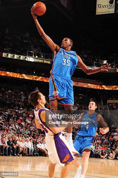 Steve Nash of the Phoenix Suns takes a charge from Kevin Durant of the Oklahoma City Thunder in an NBA game played on October 23 at U.S. Airway...