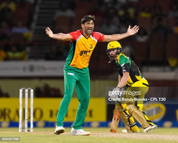 In this handout image provided by CPL T20, Sohail Tanvir of Guyana Amazon Warriors dismiss Glen Phillip of Jamaica Tallawahs lbw during Match 15 of...