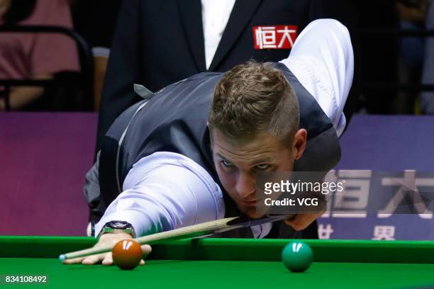 Daniel Wells of Wales plays a shot during his first round match against Judd Trump of England on day two of Evergrande 2017 World Snooker China...
