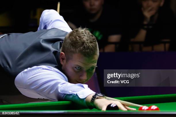 Daniel Wells of Wales plays a shot during his first round match against Judd Trump of England on day two of Evergrande 2017 World Snooker China...