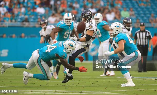 Danny Woodhead of the Baltimore Ravens loses the ball during a preseason game against the Miami Dolphins at Hard Rock Stadium on August 17, 2017 in...