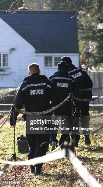 Police officers search an area near the home of missing make-up artist Diane Chenery-Wickens at Duddleswell, near Uckfield, East Sussex.