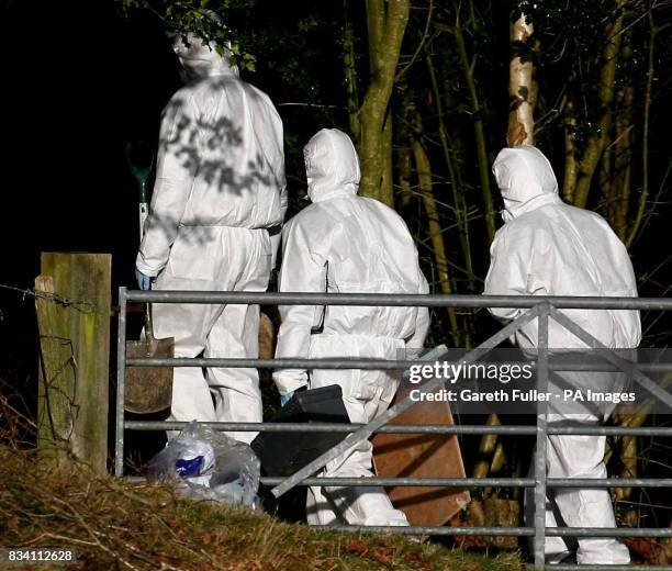 Police forensic officers search an area of woodland near the home of missing make-up artist Diane Chenery-Wickens at Duddleswell, near Uckfield, East...