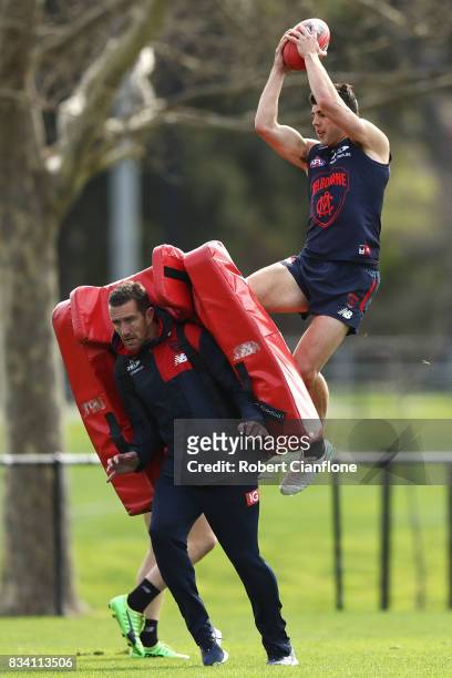 Christian Petracca takes a mark during a Melbourne Demons AFL training session at Gosch's Paddock on August 18, 2017 in Melbourne, Australia.