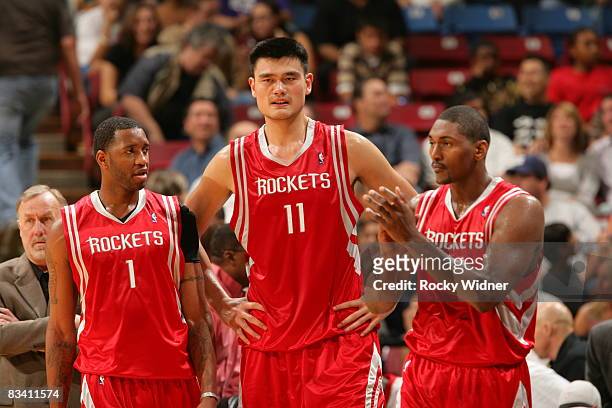 Tracy McGrady, Yao Ming and Ron Artest of the Houston Rockets get ready to take on the Sacramento Kings on October 23, 2008 at ARCO Arena in...