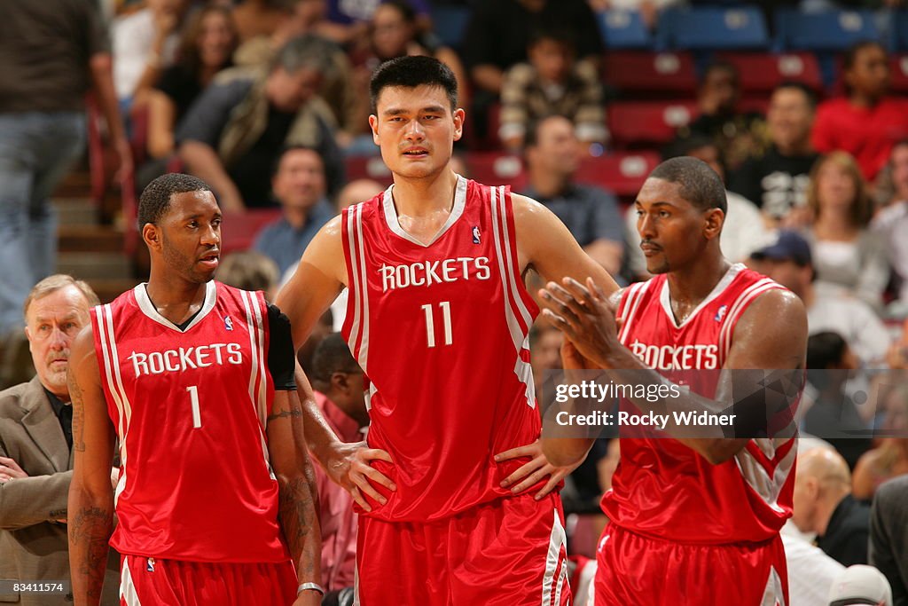 David Roy Peace Rockets Tracy McGrady, Yao Ming and Ron Artest of the Houston Rockets get ...