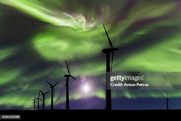 wind turbines on the background of the northern lights - murmansk stock pictures, royalty-free photos & images