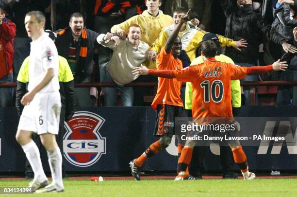 Dundee United's Morgaro Comis celebrates his goal with team mate Noal Hunt during the CIS Insurance Cup Semi Final match at Tynecastle Stadium,...