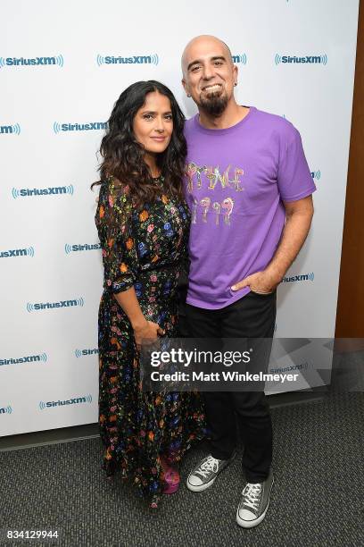 Actress Salma Hayek and SiriusXM host Tony Fly pose for a photo as Salma Hayek visits the SiriusXM Studios on August 17, 2017 in Los Angeles,...