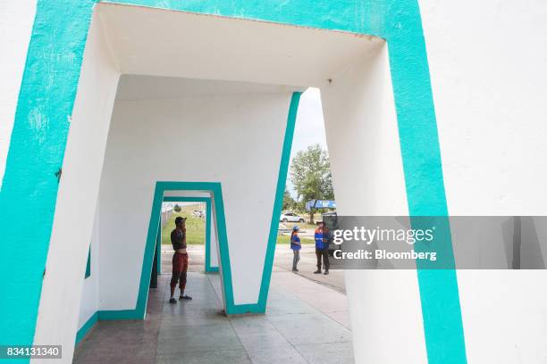 Workers stands outside the entrance to the Darkhan Thermal Power Plant in Darkhan, Mongolia, on Monday, Aug. 14, 2017. Mongolia, desperate to make...