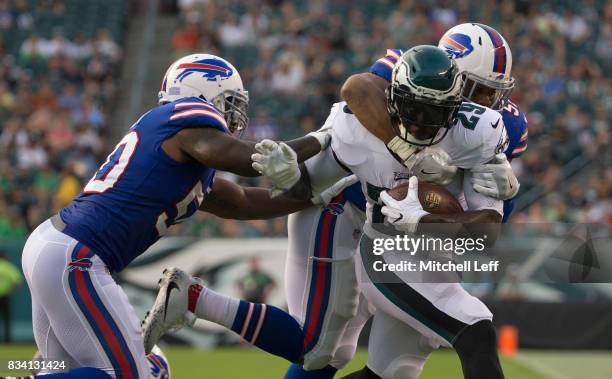 LeGarrette Blount of the Philadelphia Eagles runs the ball and is tackled by Ramon Humber and Preston Brown of the Buffalo Bills in the first quarter...