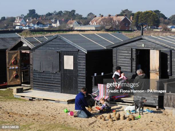 Beach huts at Walberswick on the Suffolk coast where villagers today formed a human "Save Our Shoreline" to protest at the Department for...