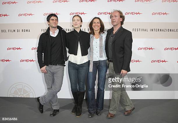 Actor Christoph Bach, actress Franziska Petri, director Connie Walther and actor Ulrich Noethen attend the Long Shadows Photocall during the 3rd Rome...