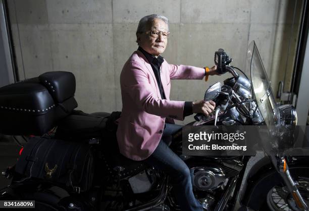 Lawyer Hiroyuki Kawai poses with his Harley-Davidson Inc. Trike motorcycle inside a garage in Tokyo, Japan, on Tuesday, July 25, 2017. Kawai is...