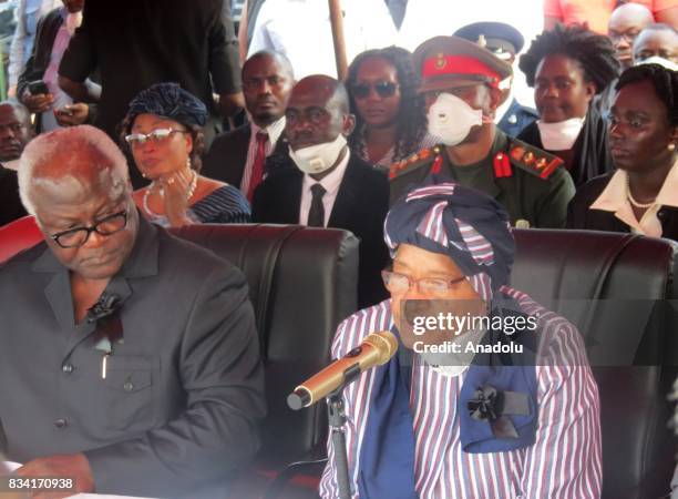 Sierra Leone's President Ernest Bai Koroma and Liberia's President Ellen Johnson Sirleaf attend the funeral ceremony for the victims of a mudslide on...