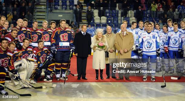 Queen Elizabeth ll, accompanied by President Ivan Gasparovic, prepares to start an ice hockey match between Aqua City Poprad and Guildford Flames at...